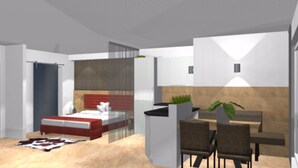A modern bedroom with a bed, bedside table, and a small seating area with chairs and a table. - Appartements Bergsonne (Westendorf)
