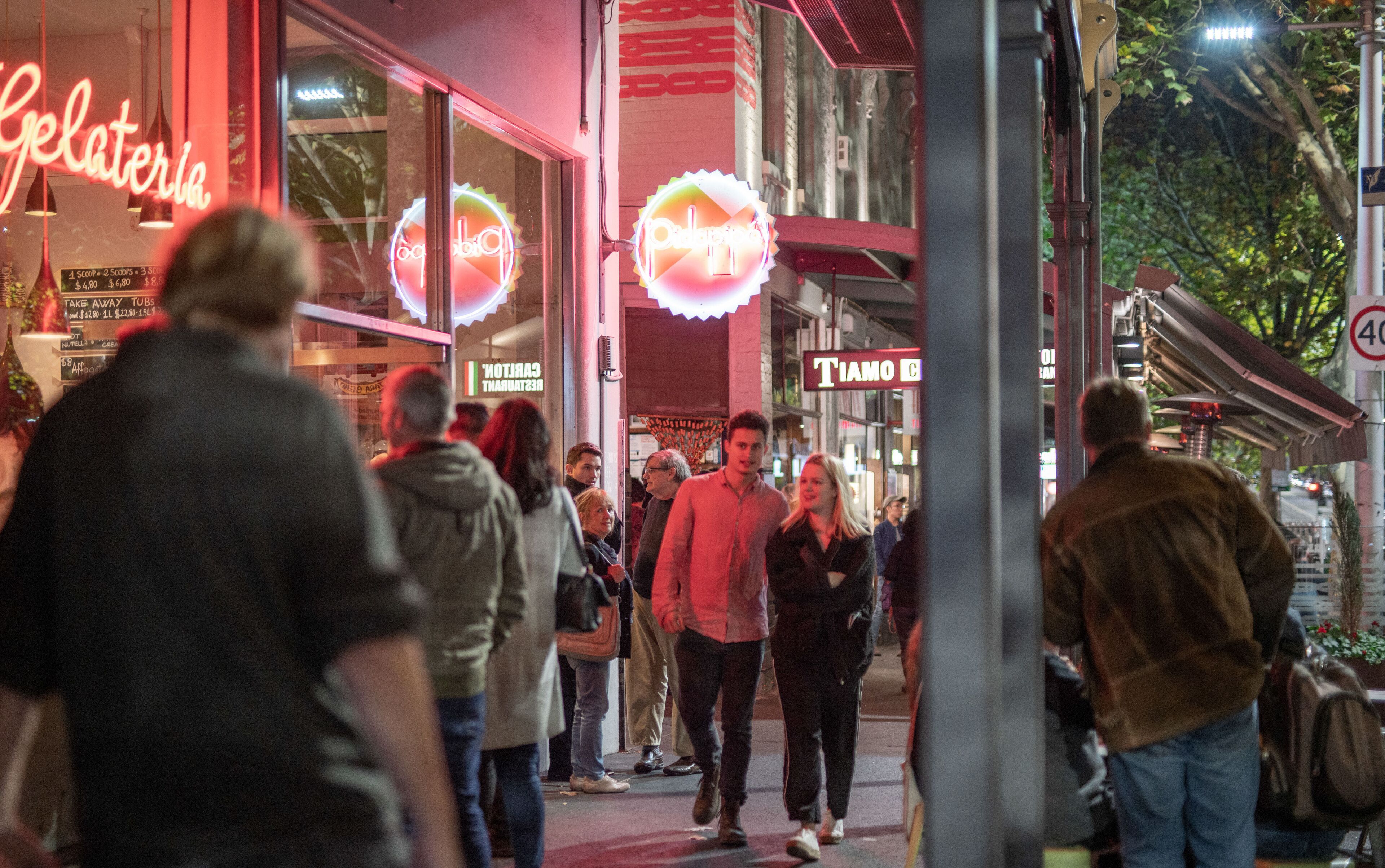 A busy street scene with people walking.