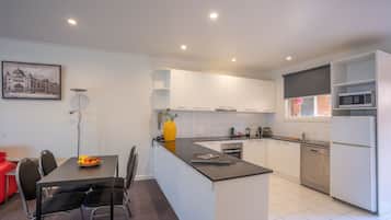 Executive One Bedroom | Private kitchen | Full-sized fridge, microwave, stovetop, dishwasher
