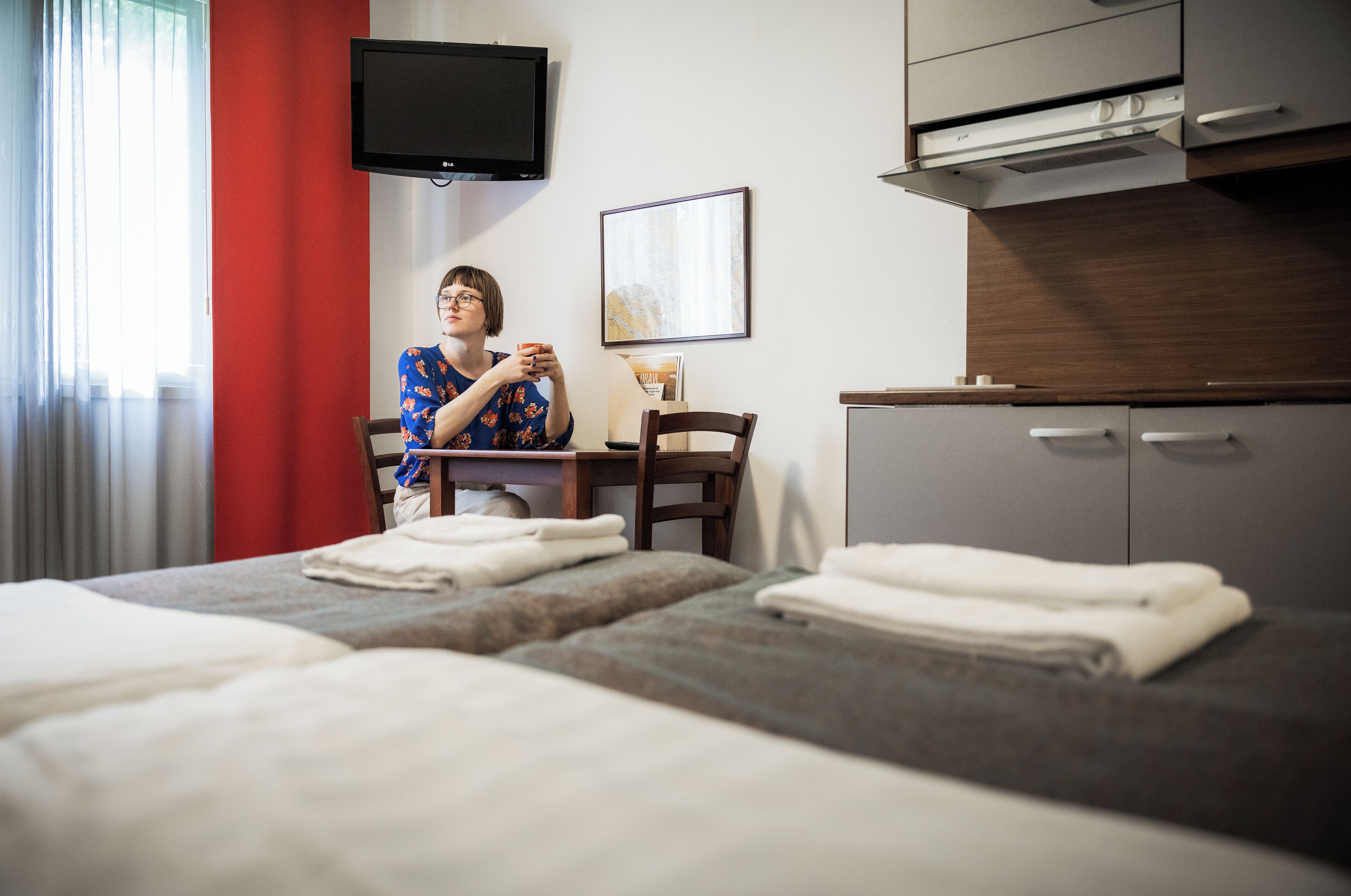 hypo-allergenic bedding, desk, laptop workspace, blackout curtains