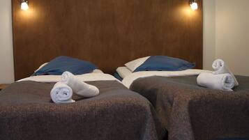 Hypo-allergenic bedding, desk, laptop workspace, blackout drapes