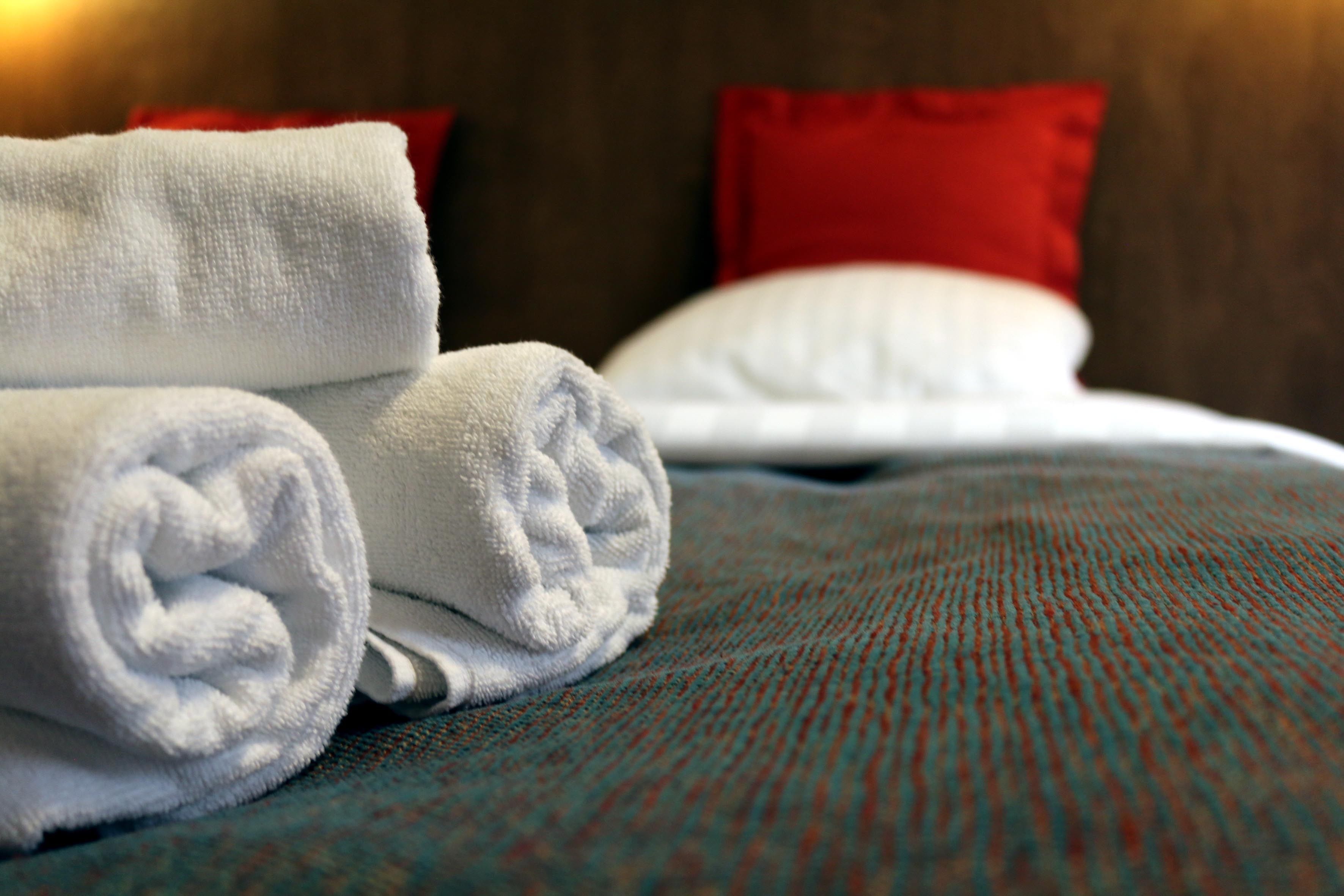 hypo-allergenic bedding, desk, laptop workspace, blackout curtains