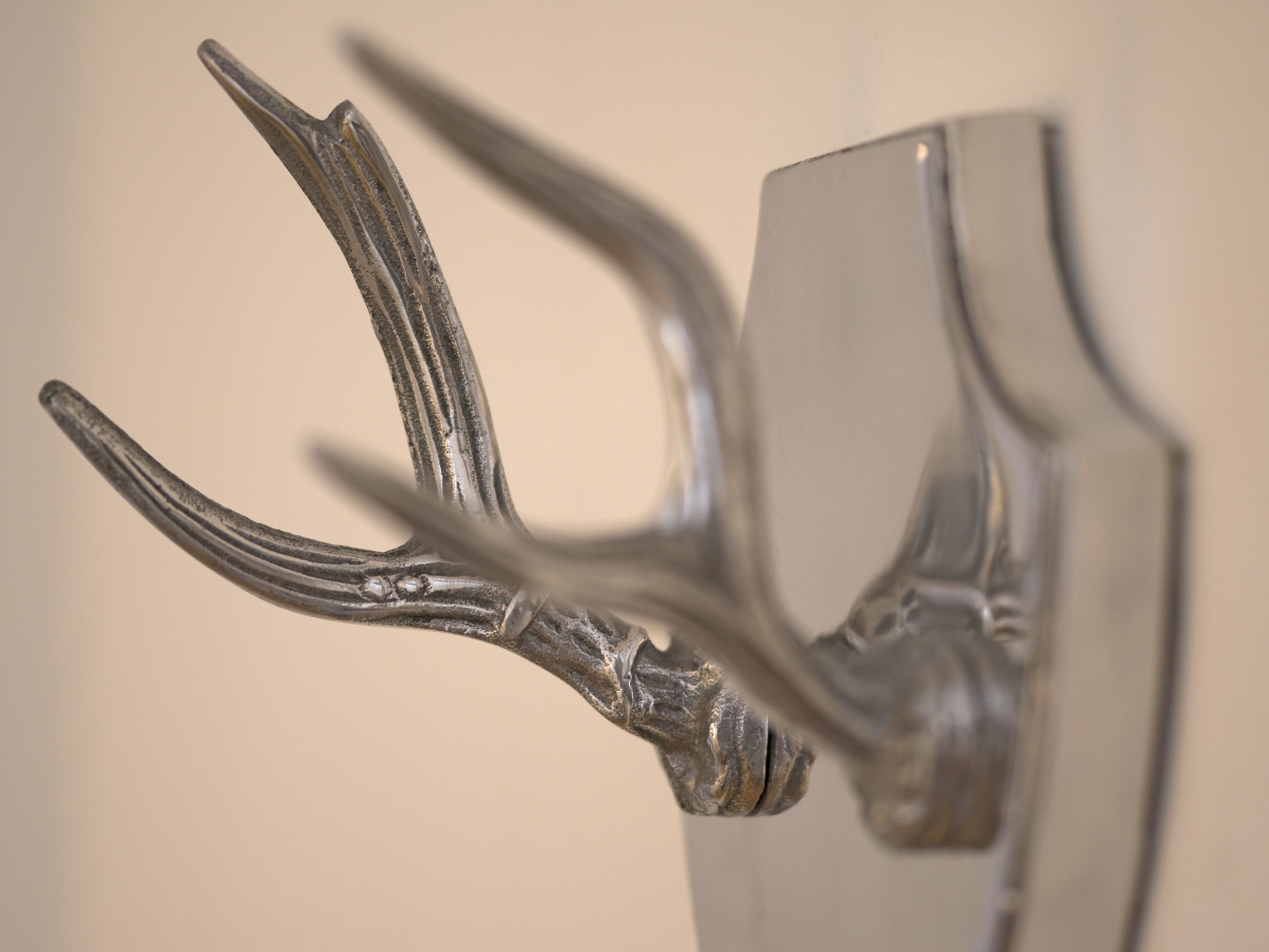 A close-up of a metallic sculpture with abstract shapes and curves.