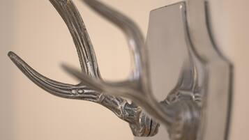 A close-up of a metallic sculpture with abstract shapes and curves.