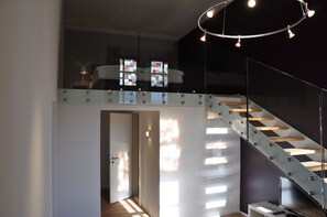 Deluxe Suite (Loft) | Premium bedding, down comforters, pillowtop beds, individually decorated