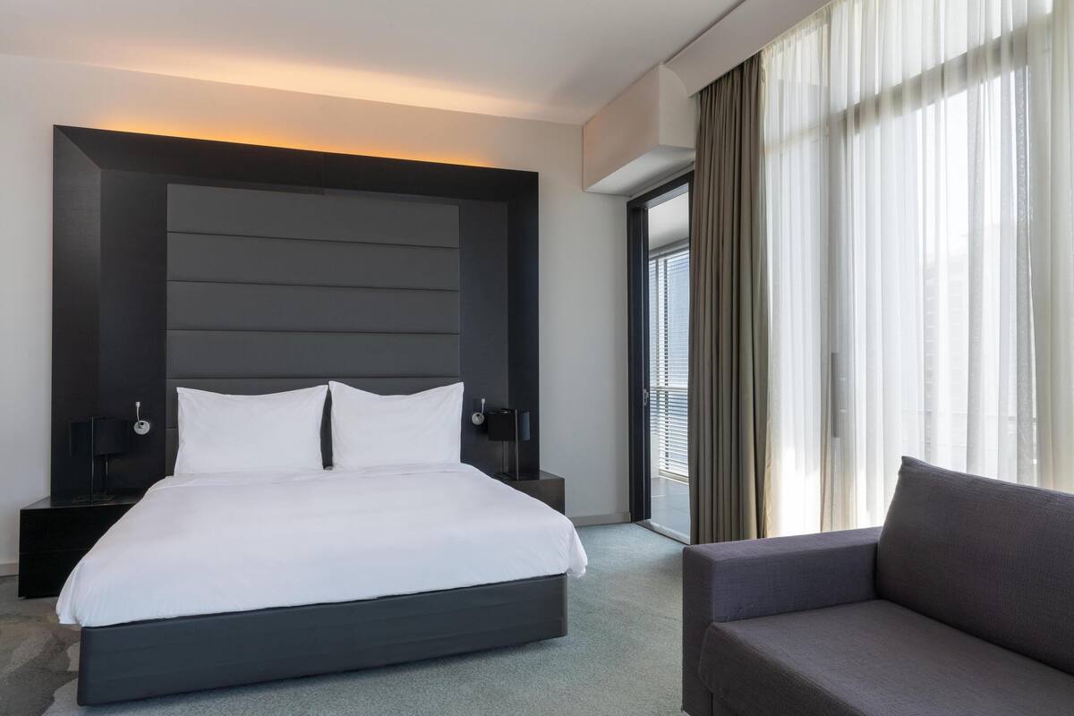 Junior Suite, Balcony, Sea View | Minibar, in-room safe, desk, laptop workspace