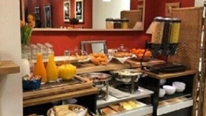 A buffet setup with various food items and utensils. - Villa Val Sénart (Quincy-sous-Senart)