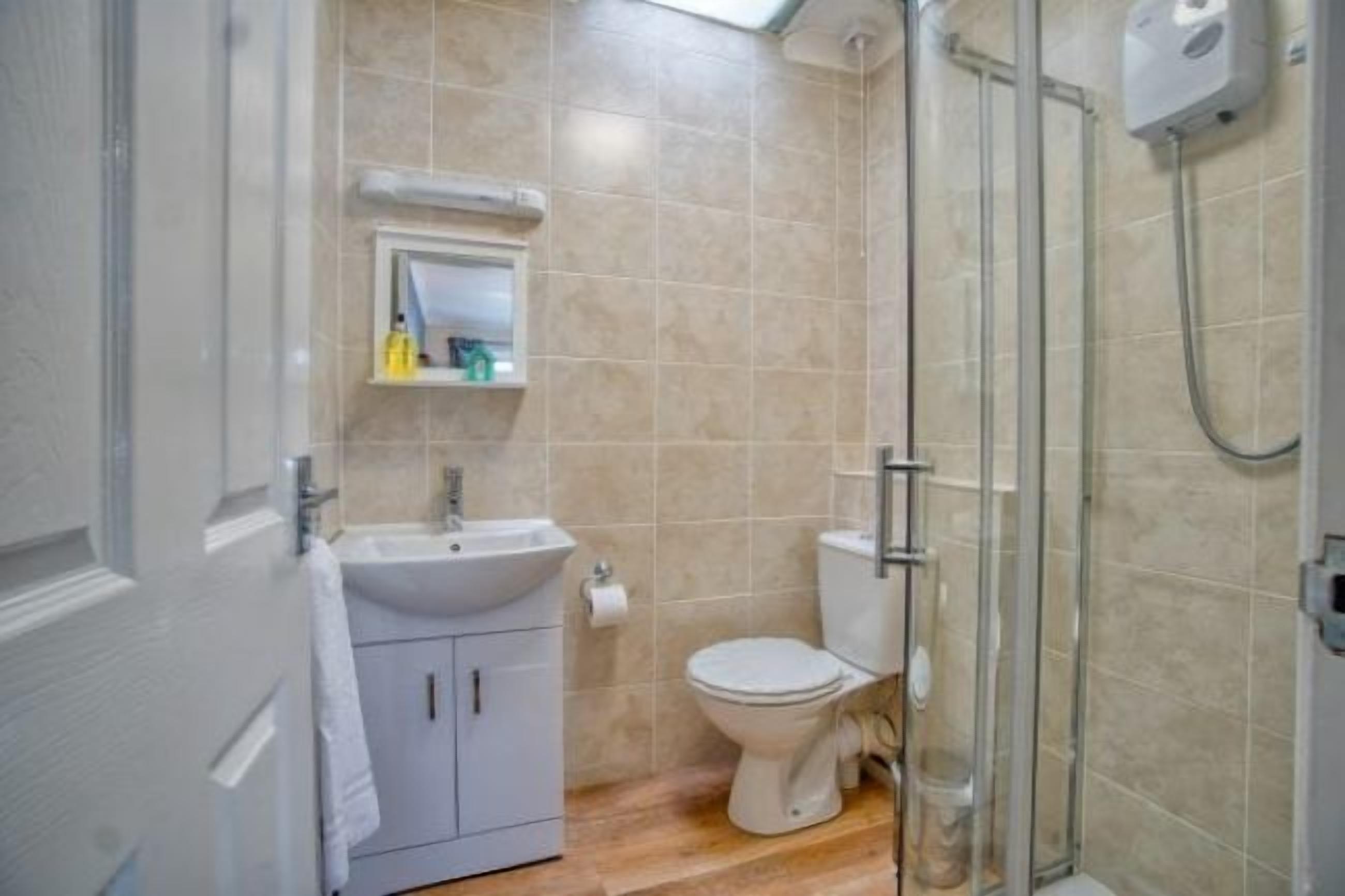 family room | bathroom | shower, rainfall showerhead, free toiletries, hair dryer
