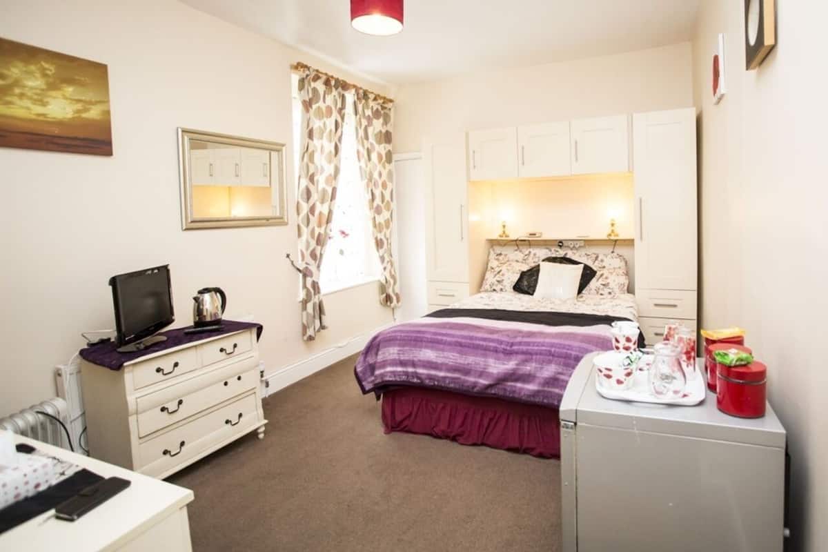 Suite, baño privado | 1 dormitorio, cortinas opacas, wifi gratis y ropa de cama