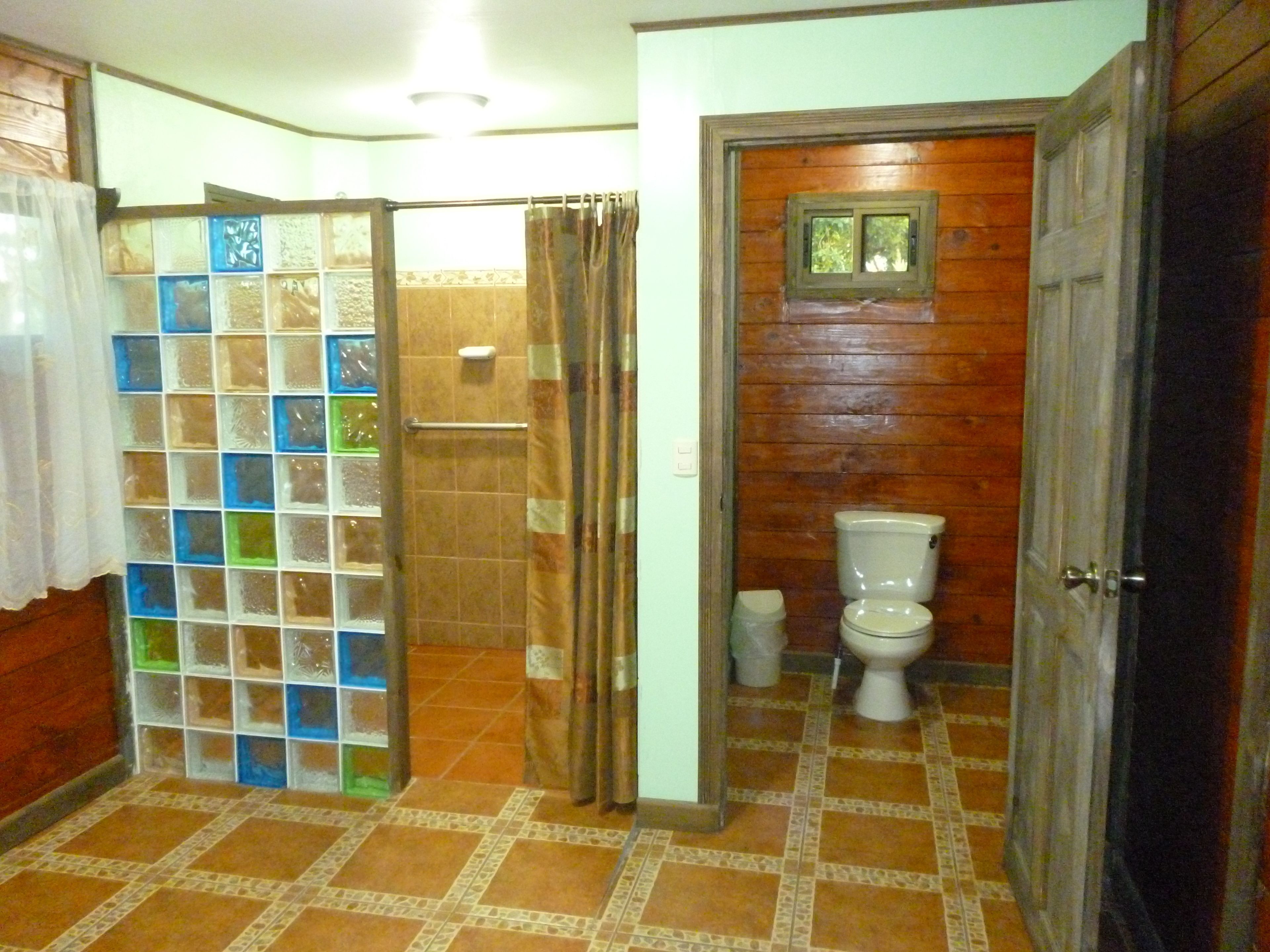 deluxe cabin, 1 king bed | bathroom | shower, eco-friendly toiletries, hair dryer, bathrobes