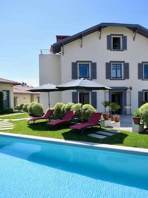 Seasonal outdoor pool, pool umbrellas, pool loungers