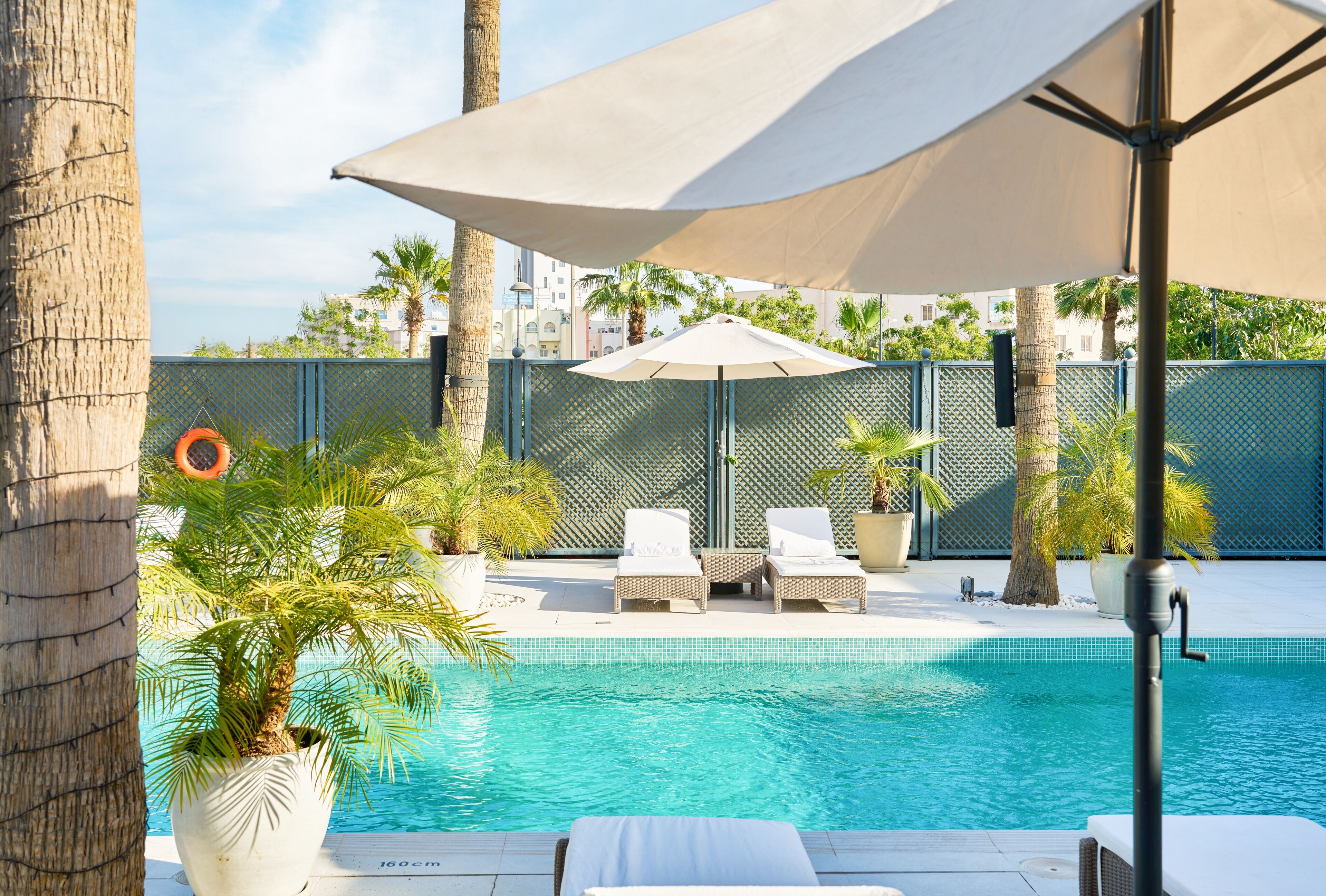 Outdoor pool, open 7:00 AM to 7:00 PM, pool loungers