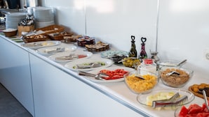 A buffet with various food items including fruits, cereals, and desserts. - Sultanahmet Cesme Hotel (Istanbul)