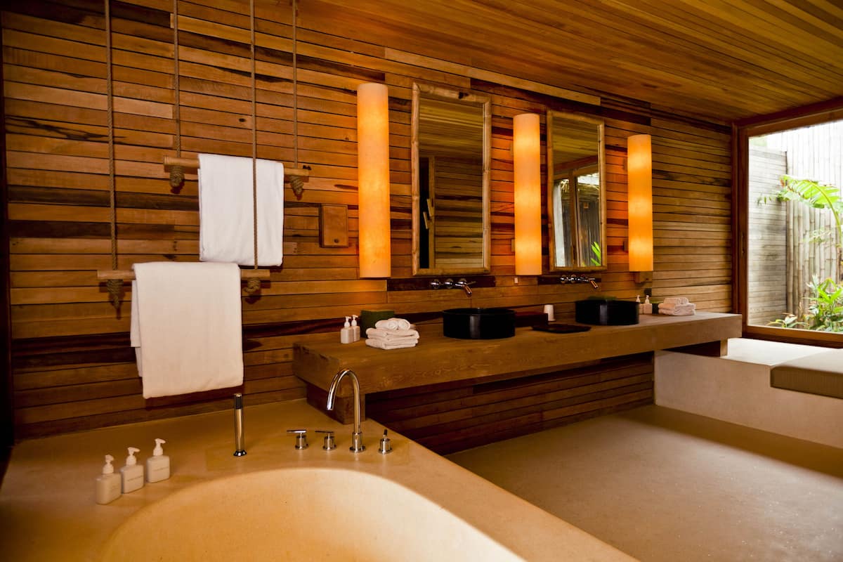 beachfront deluxe pool villa | bathroom | separate bathtub and shower, rainfall showerhead, free toiletries
