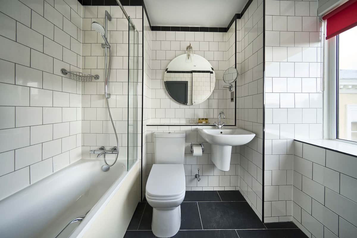 family room | bathroom | eco-friendly toiletries, hair dryer, towels, shampoo