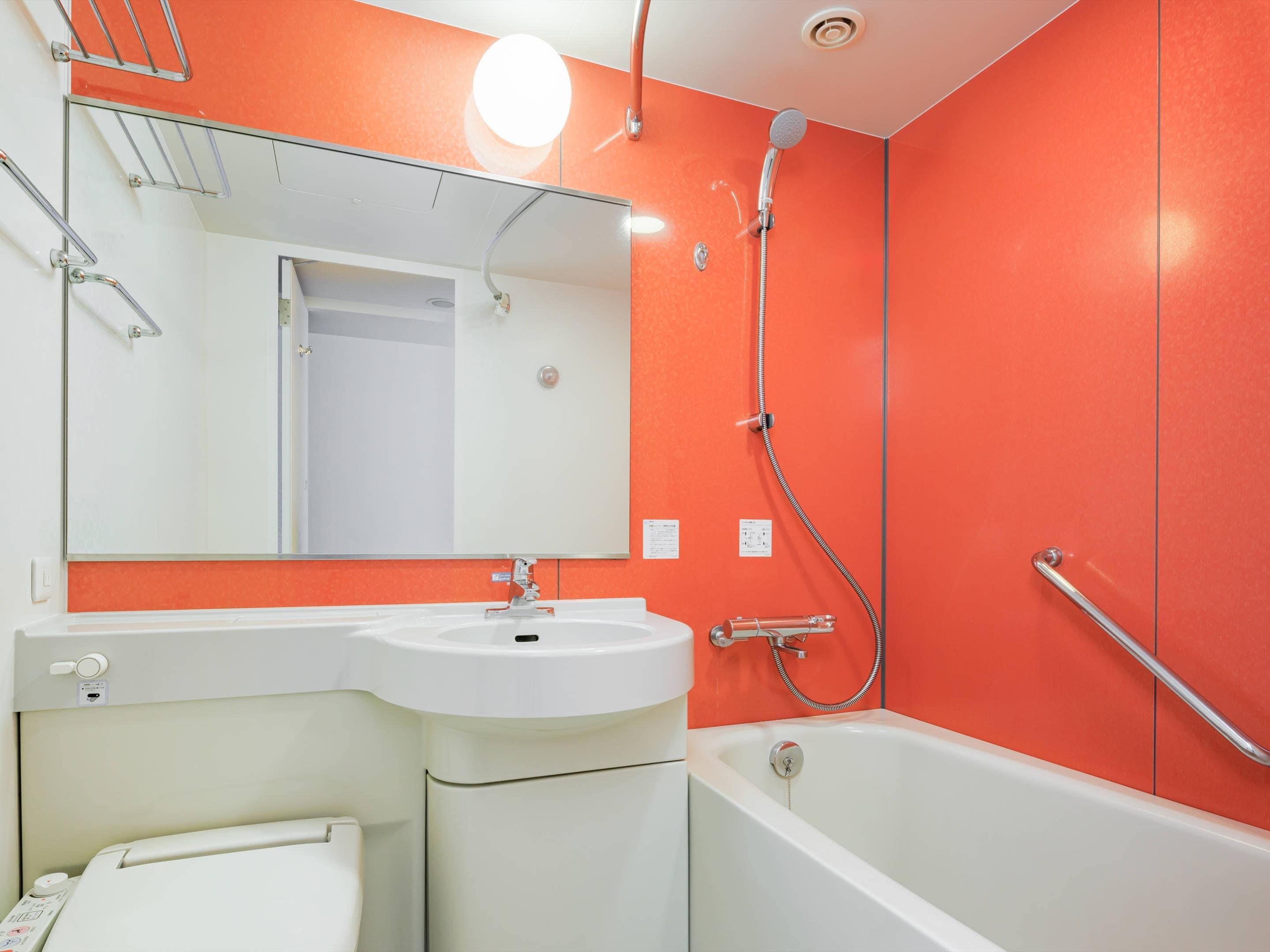 Combined shower/tub, free toiletries, hair dryer, slippers
