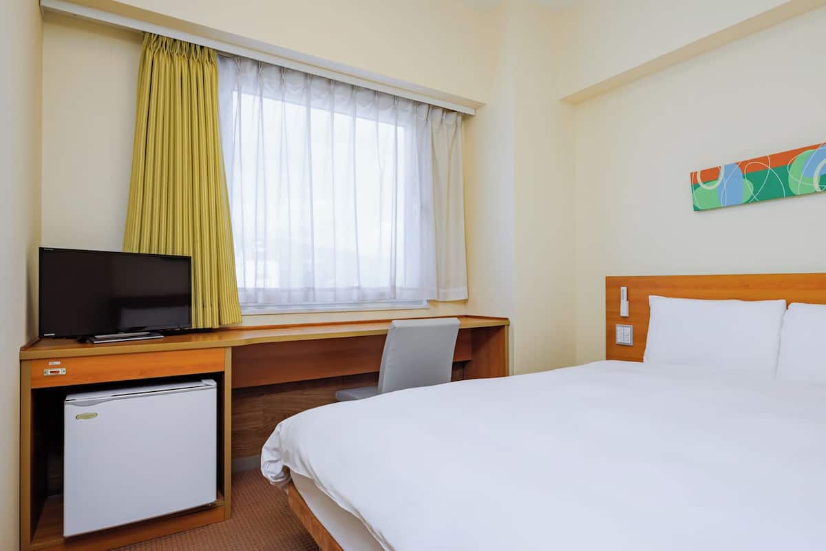 Down duvets, desk, laptop workspace, blackout curtains