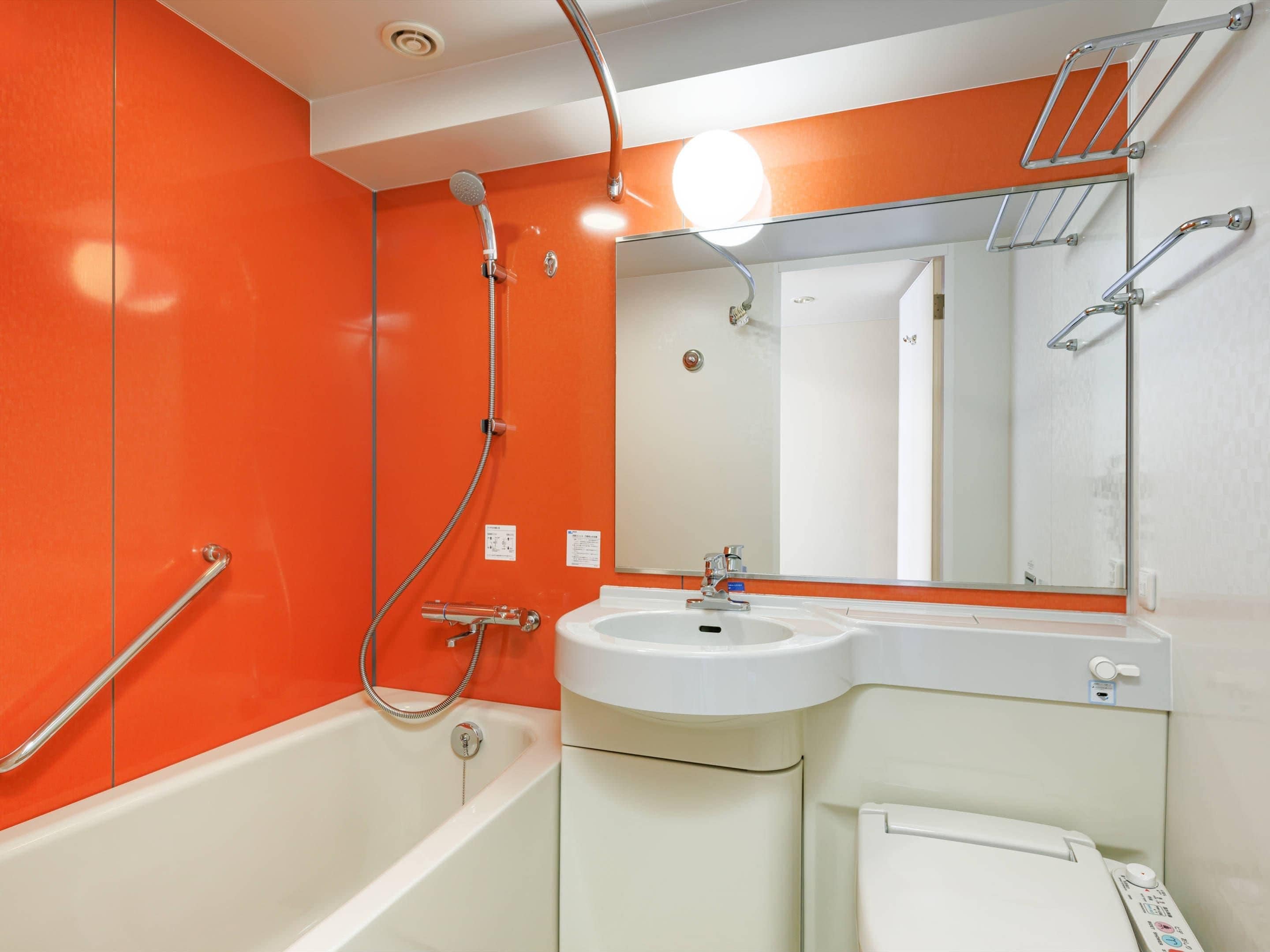Combined shower/tub, free toiletries, hair dryer, slippers