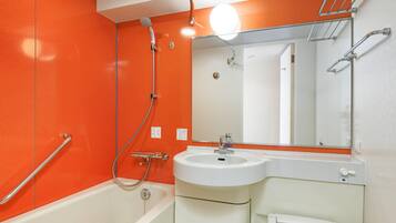 Combined shower/tub, free toiletries, hair dryer, slippers