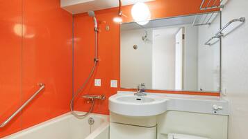 Combined shower/tub, free toiletries, hair dryer, slippers