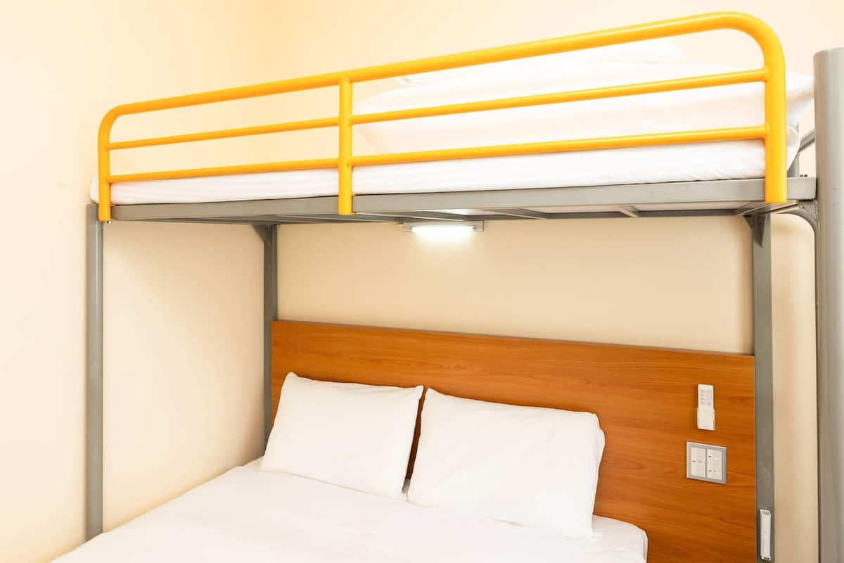 Down duvets, desk, laptop workspace, blackout curtains