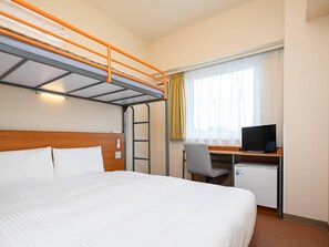 A hotel room with a bunk bed, a desk with a computer, and a window with curtains. - Comfort Inn Niigata Chuo Inter (Niigata)