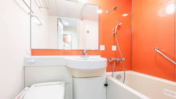 Combined shower/tub, free toiletries, hair dryer, slippers