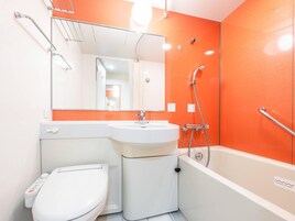Combined shower/tub, free toiletries, hair dryer, slippers