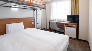 A hotel room with a bunk bed, a desk with a computer, a television, and a window with curtains. - Comfort Inn Hitachinaka (Hitachinaka)