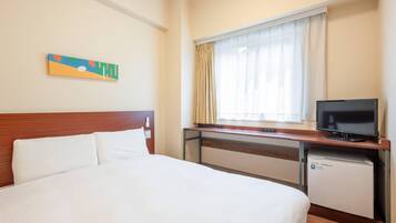 Down duvets, desk, laptop workspace, blackout curtains