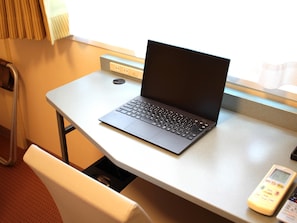Down duvets, desk, laptop workspace, blackout curtains