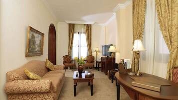 Premium Suite | Living area | TV, DVD player, iPod dock