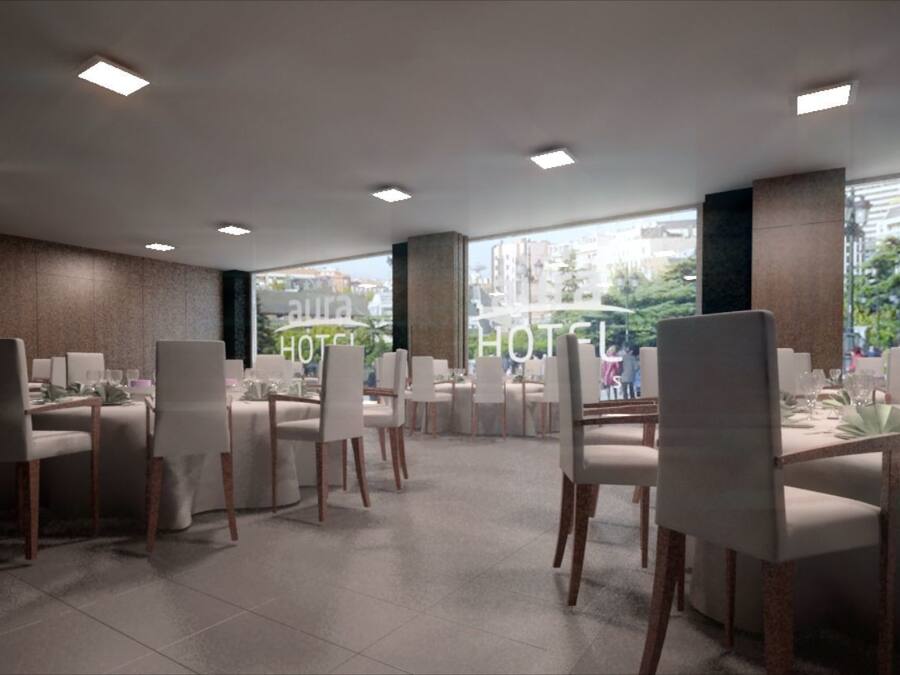 A modern hotel dining area with multiple tables and chairs, large windows offering a city view, and recessed ceiling lighting.