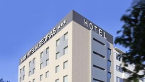 A multi-story hotel building with a modern design, featuring a prominent sign that reads "AURA HOTEL ALGECIRAS." - Sercotel Aura Algeciras (Algeciras)