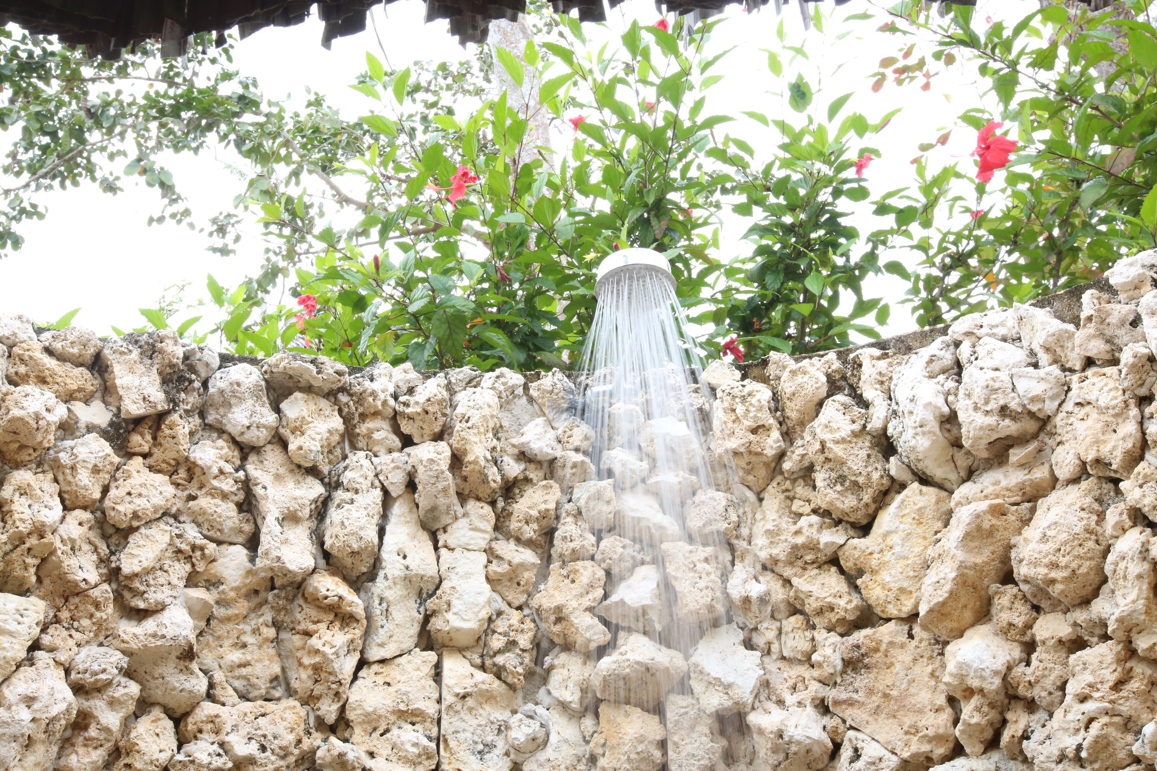 A stone wall with a water feature.