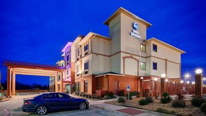 A Best Western hotel with a modern design, featuring a covered entrance and a parking area.