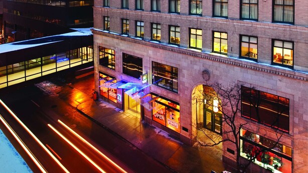 A multi-story hotel with a classic brick facade, large windows, and a prominent Liberty Building sign. - Hyatt Place Des Moines/Downtown (Des Moines)