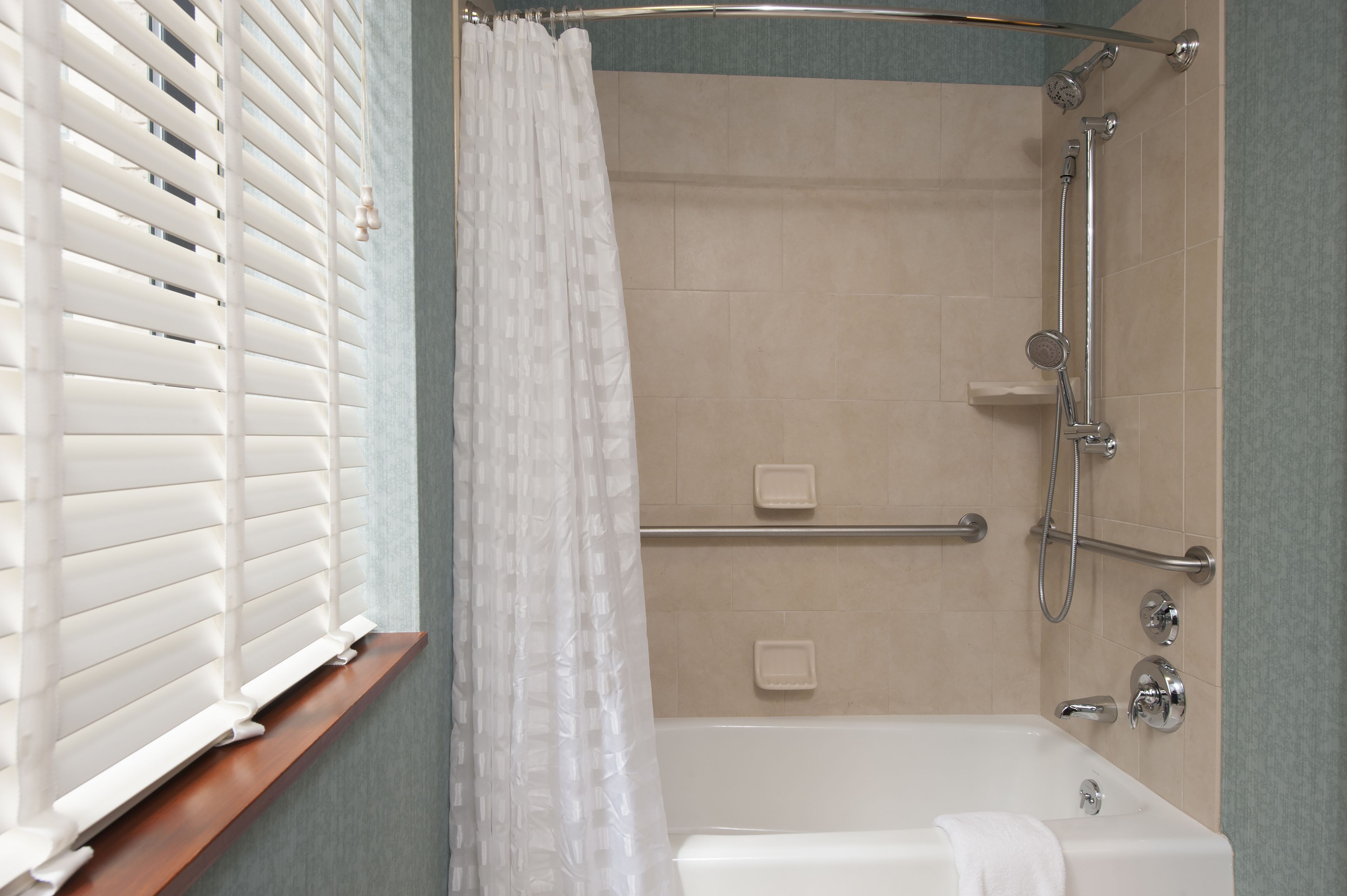 designer toiletries, hair dryer, towels, soap