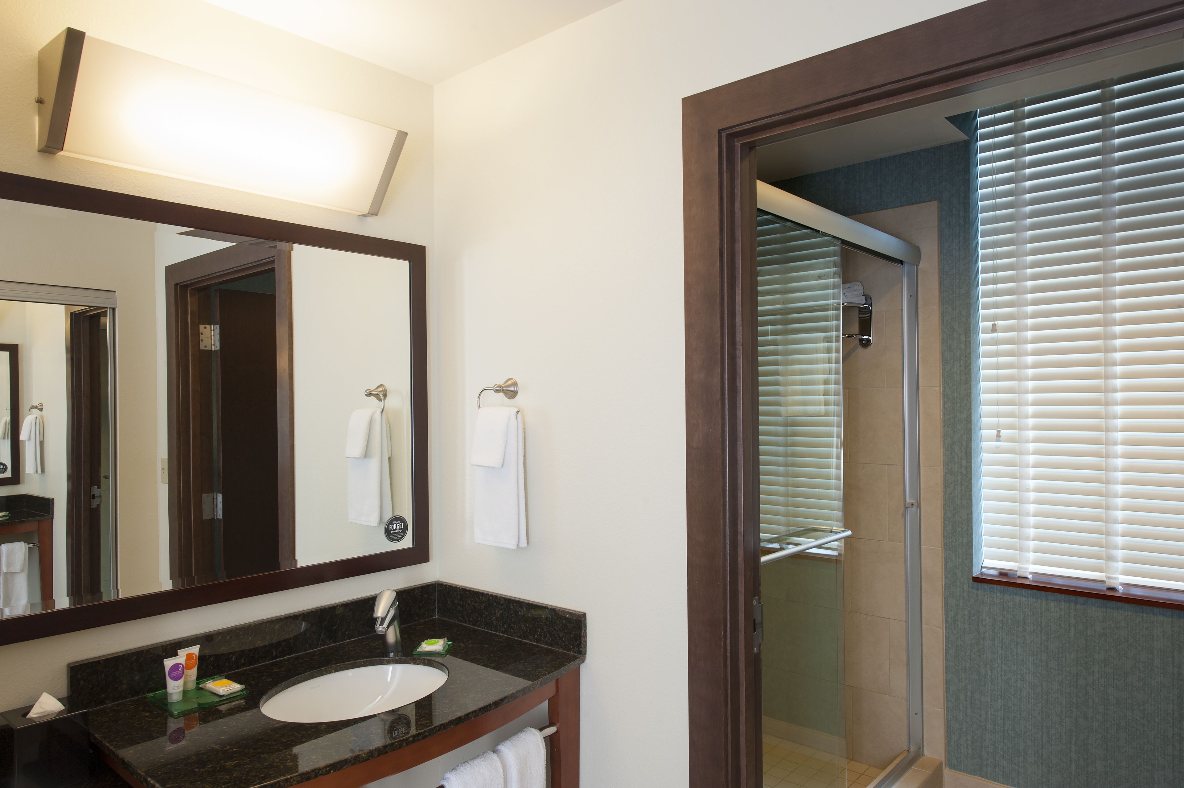 designer toiletries, hair dryer, towels, soap