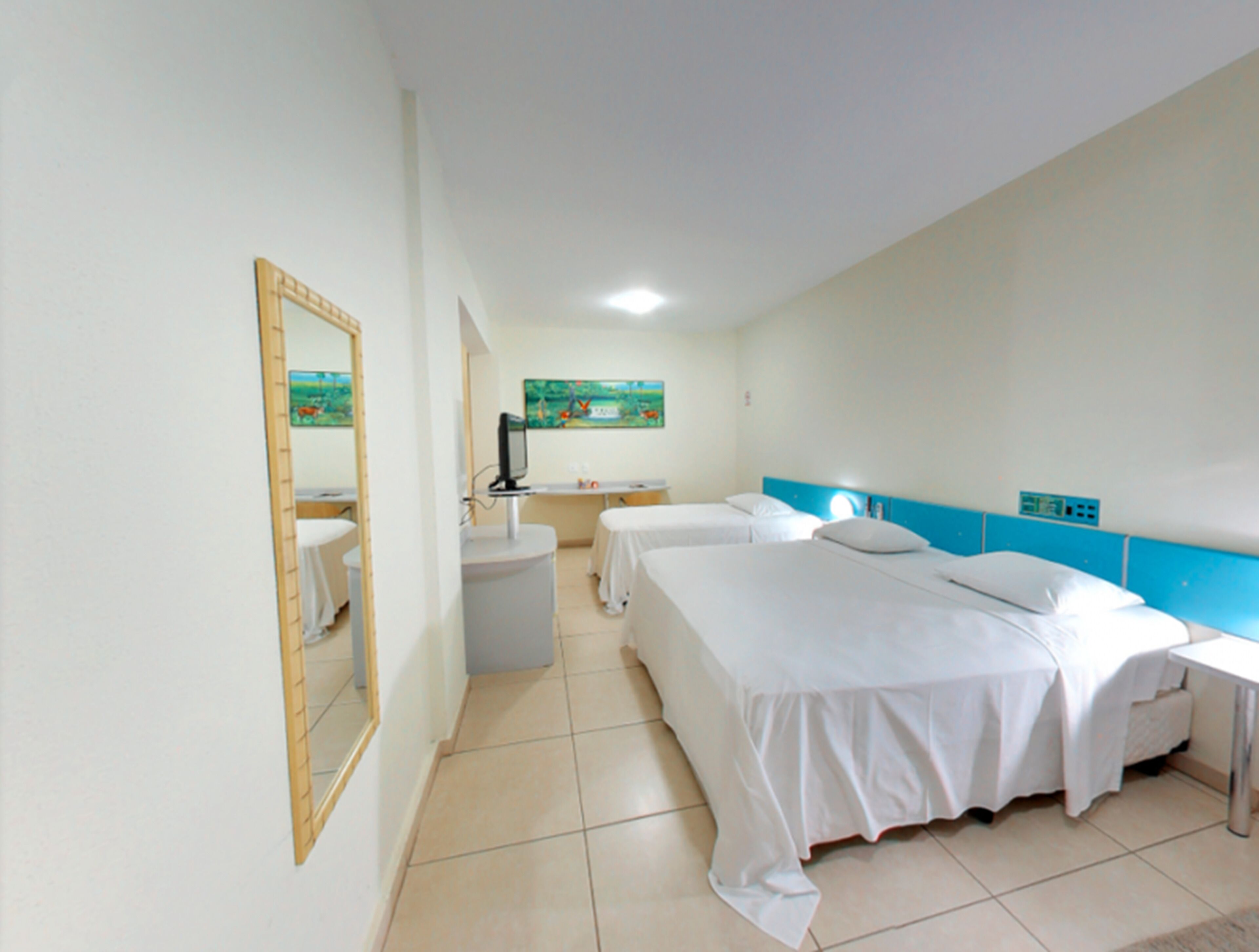 deluxe triple room | minibar, in-room safe, desk, blackout curtains