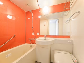 Combined shower/tub, free toiletries, hair dryer, slippers