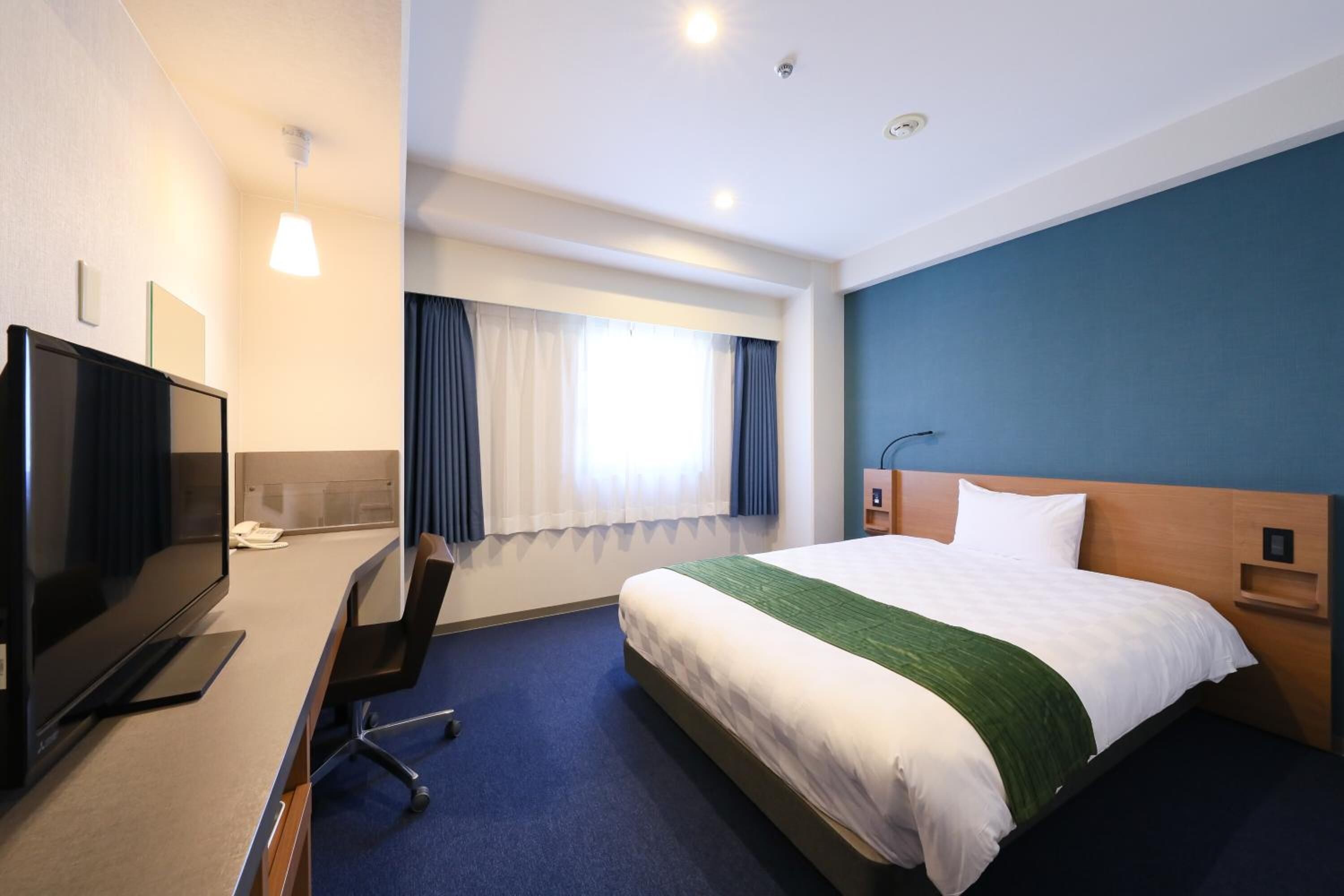 premium bedding, desk, blackout curtains, iron/ironing board