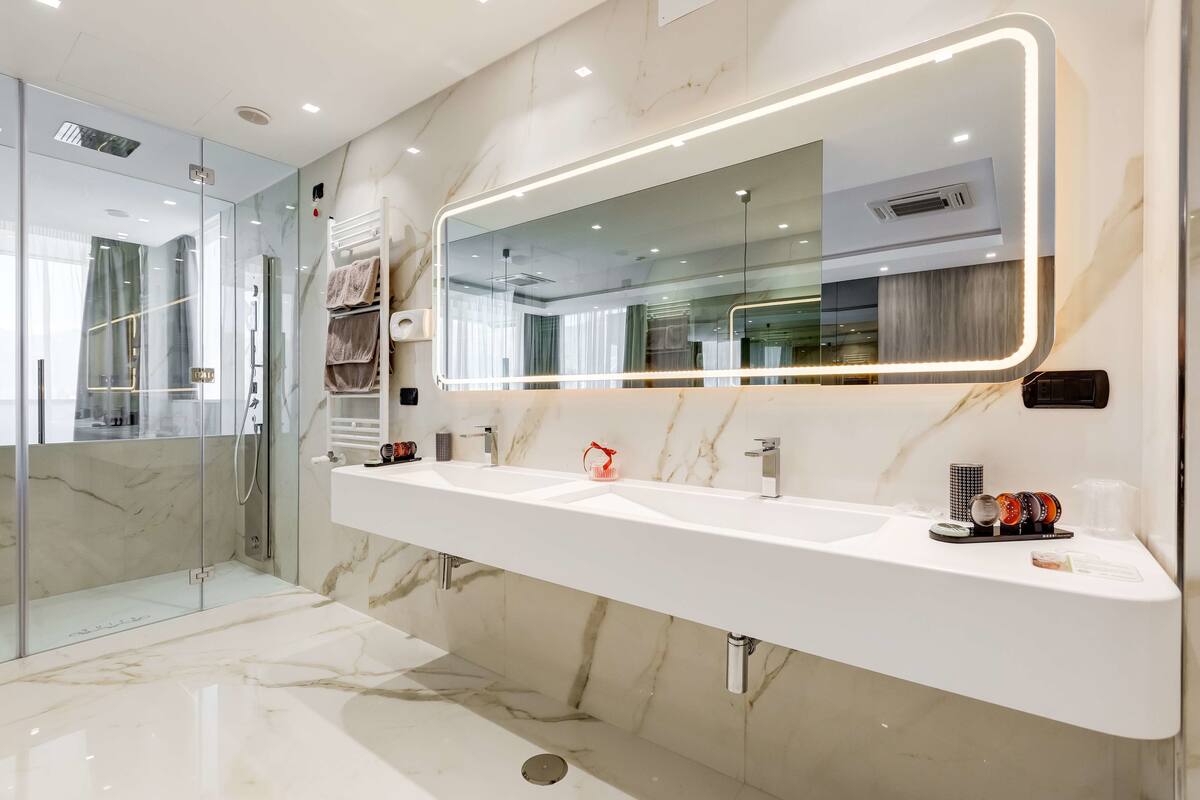 suite, 1 king bed, balcony (living room) | bathroom | free toiletries, hair dryer, slippers, bidet