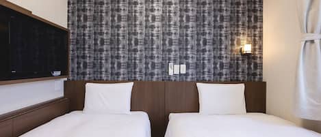 Small Twin Room - Non-Smoking | Down comforters, desk, blackout drapes, free WiFi