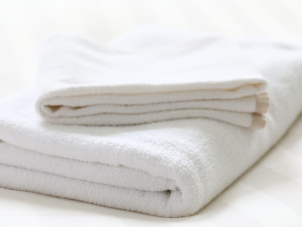 A stack of white towels. - KOKO HOTEL Himeji Castle (Himeji)