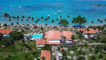 On the beach, white sand, sun loungers, beach umbrellas