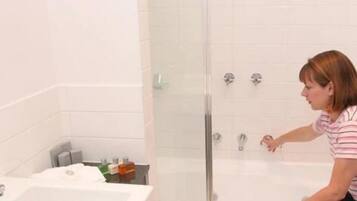 Two Bedroom Standard Apartment | Bathroom | Shower, hair dryer, towels, shampoo