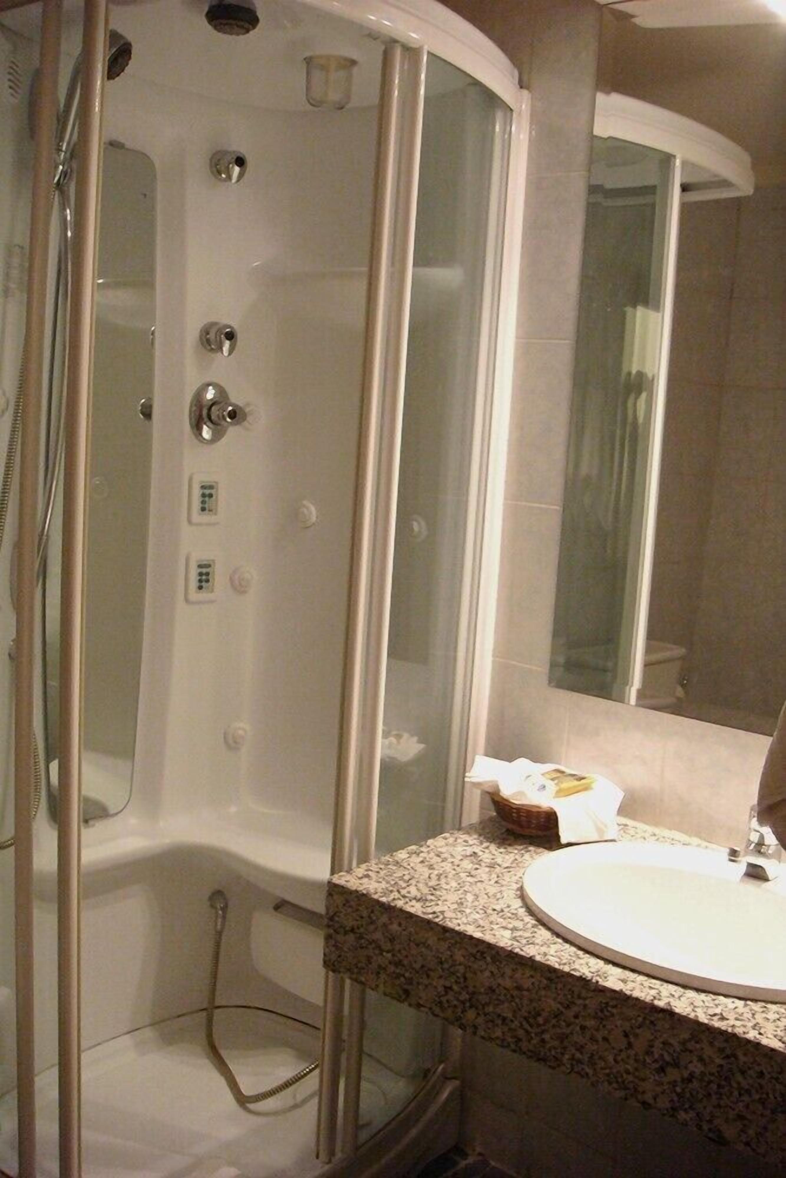 deep-soaking bathtub, rainfall showerhead, designer toiletries