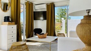 Suite Deluxe, 1 habitación | Área de sala de estar