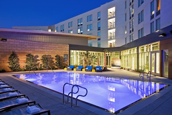 Outdoor pool, open 6:00 AM to 10:00 PM, sun loungers